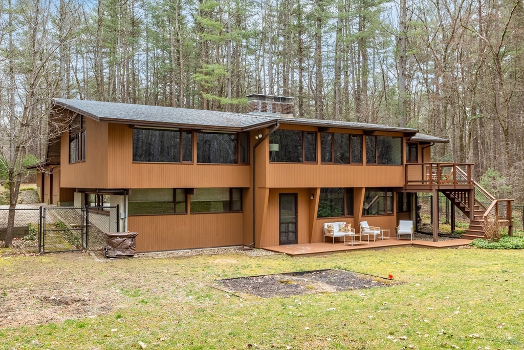 69 Long Ridge Road Carlisle, MA 01741 - Photo 37 of 42 a front view of a house with a yard
