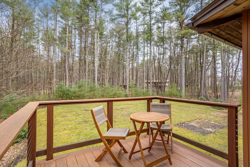 69 Long Ridge Road Carlisle, MA 01741 - Photo 41 of 42 a view of a chairs and table in the patio
