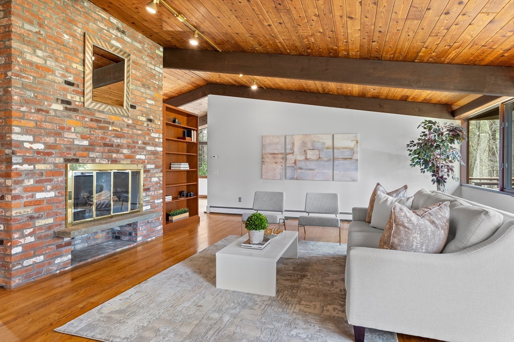 69 Long Ridge Road Carlisle, MA 01741 - Photo 7 of 42 a living room with furniture and a wooden floor