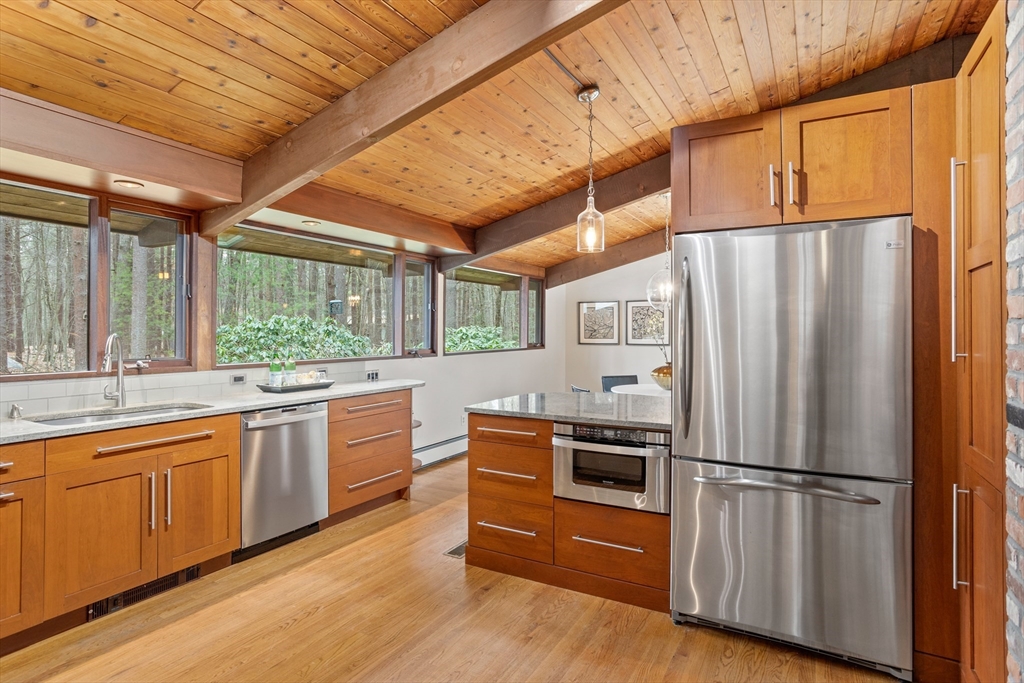 69 Long Ridge Road Carlisle, MA 01741 - Photo 10 of 42 a kitchen with stainless steel appliances a refrigerator and a sink