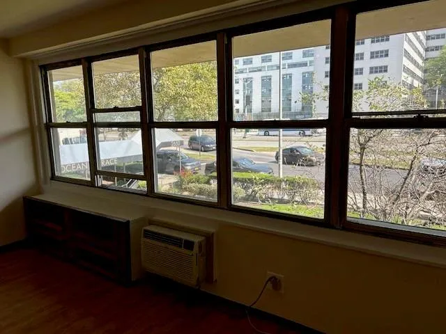 a view of an empty room with a window
