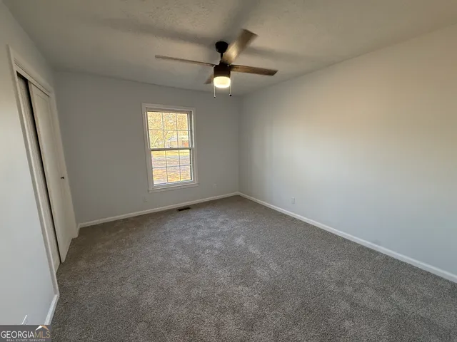 a bathroom with a toilet sink and shower