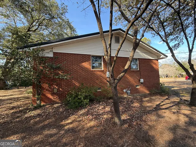 a backyard of a house with lots of green space