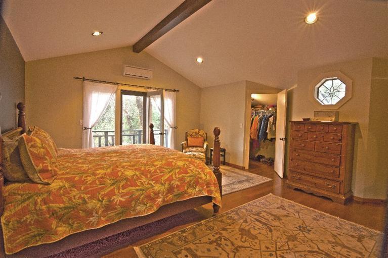 2459 Hugo Road Merlin, OR 97532 - Photo 14 of 37 a bed sitting in a spacious bedroom next to a window