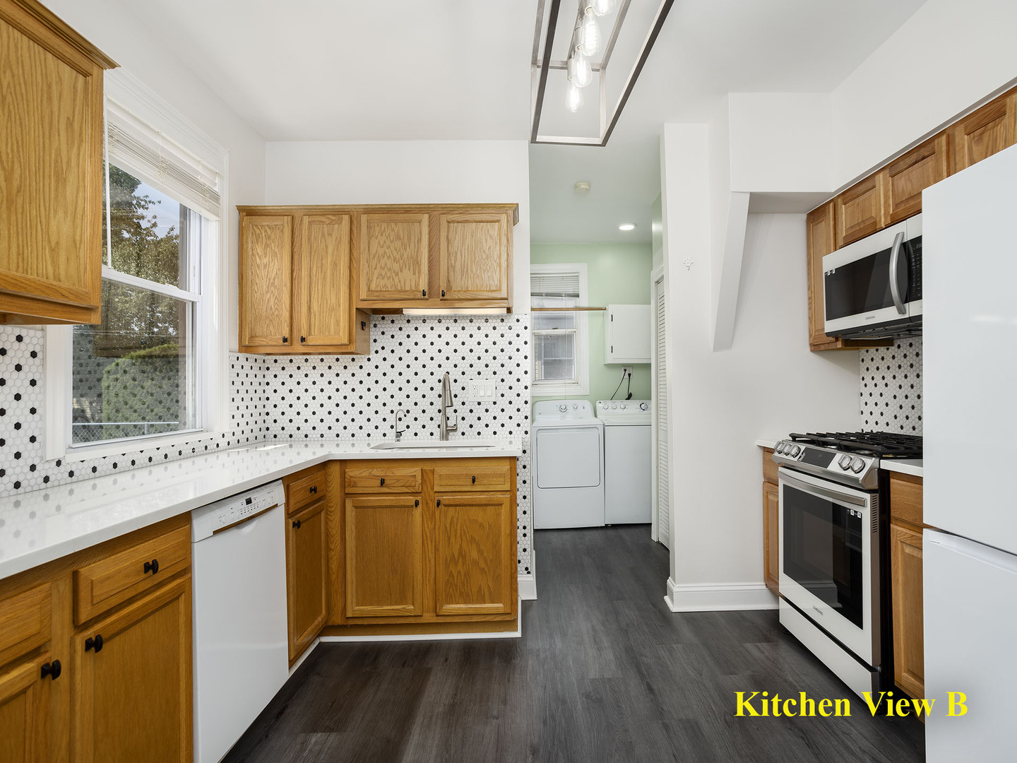 17836 Wildwood Avenue Lansing, IL 60438 - Photo 11 of 22 a kitchen with stainless steel appliances granite countertop a stove a sink and a microwave
