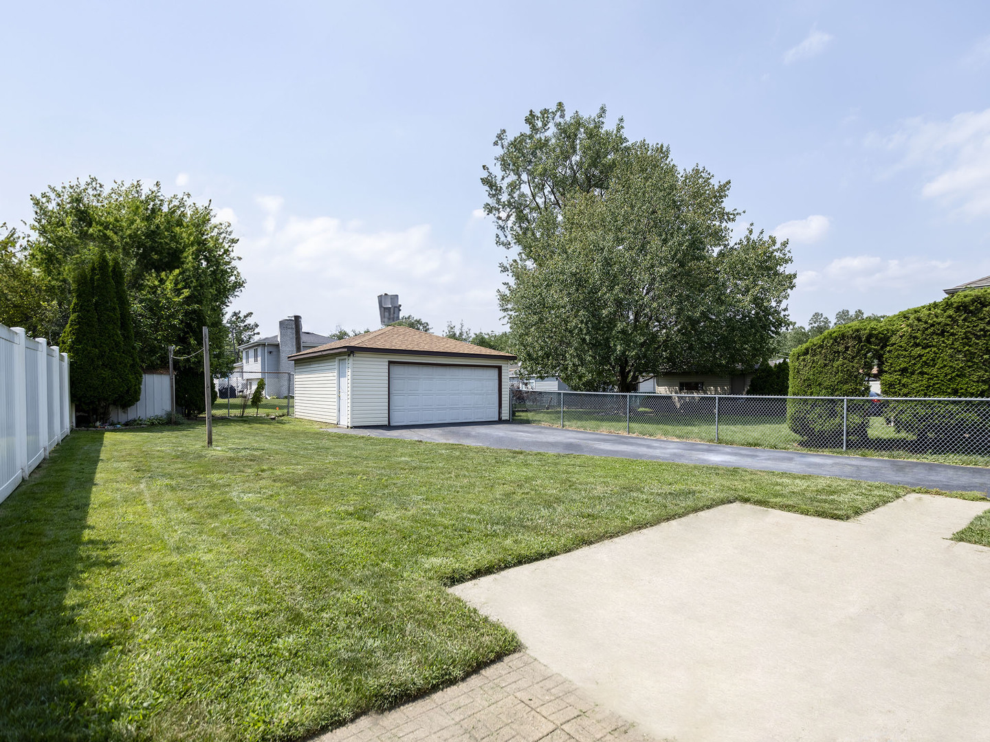 17836 Wildwood Avenue Lansing, IL 60438 - Photo 19 of 22 a view of a house with backyard and a garden
