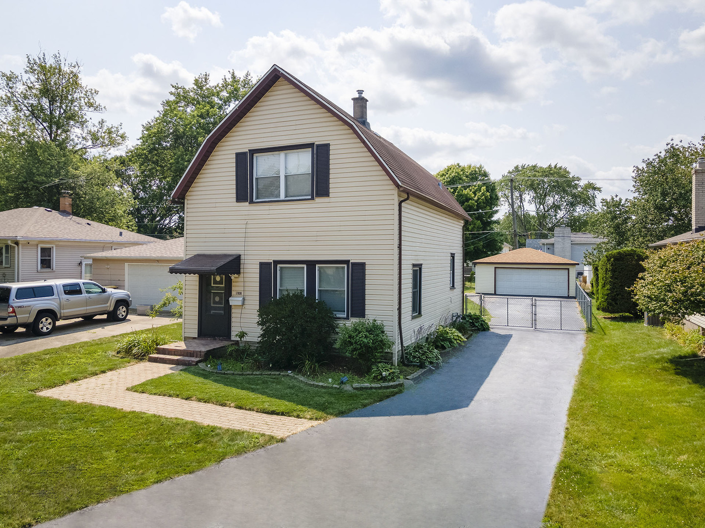 17836 Wildwood Avenue Lansing, IL 60438 - Photo 2 of 22 a front view of house with yard and green space