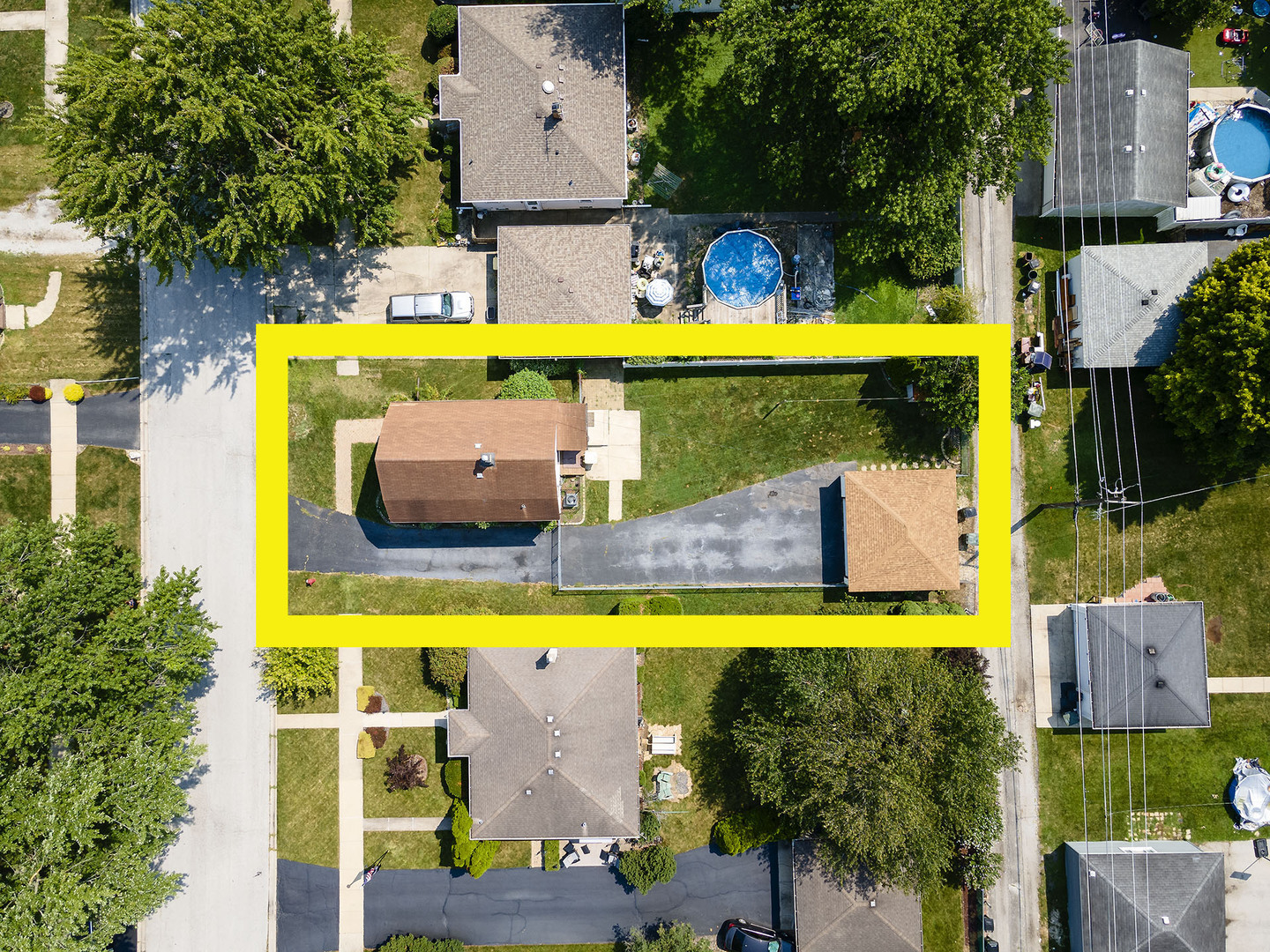 17836 Wildwood Avenue Lansing, IL 60438 - Photo 22 of 22 an aerial view of a swimming pool with a lawn chairs