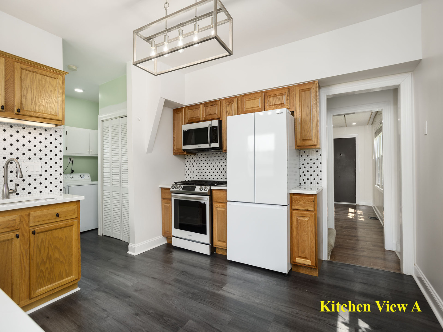 17836 Wildwood Avenue Lansing, IL 60438 - Photo 10 of 22 a kitchen with stainless steel appliances a refrigerator and a stove top oven