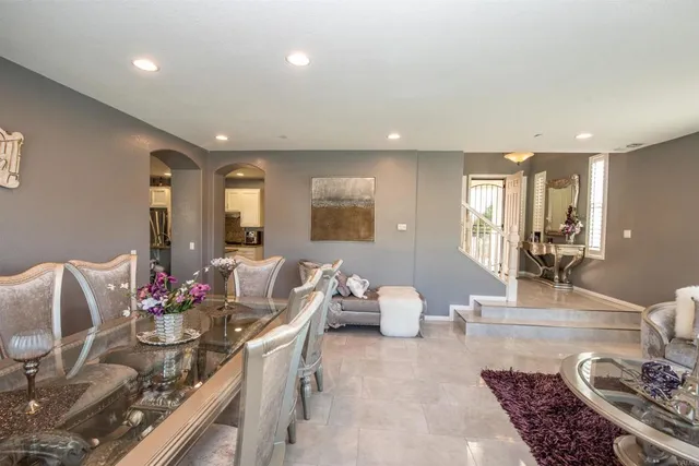 a living room with furniture potted plant and a window