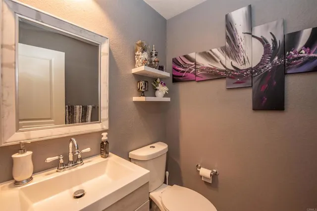 a living room with furniture ceiling fan and a window