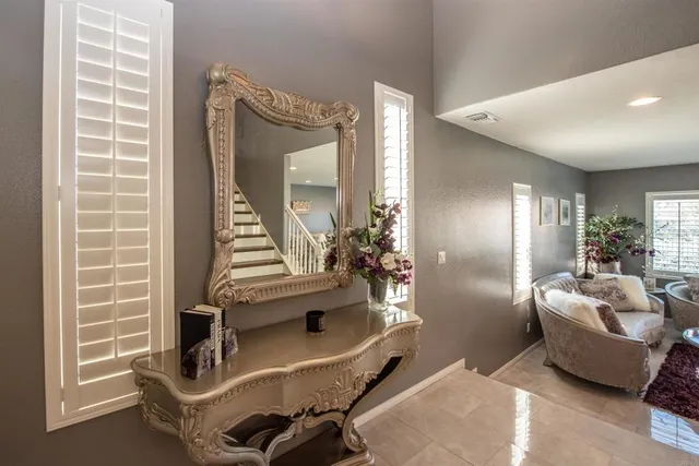 a living room with furniture and kitchen view