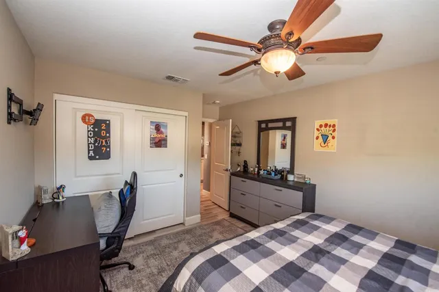 a view of a swimming pool with a fountain and a big yard