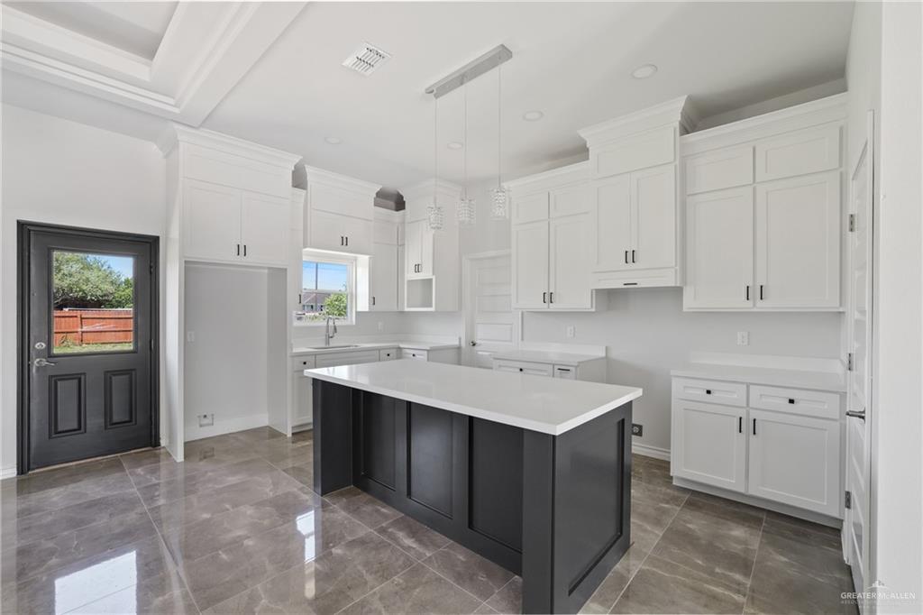 1003 Short Road San Juan, TX 78589 - Photo 15 of 20 a kitchen with a sink stove and cabinets