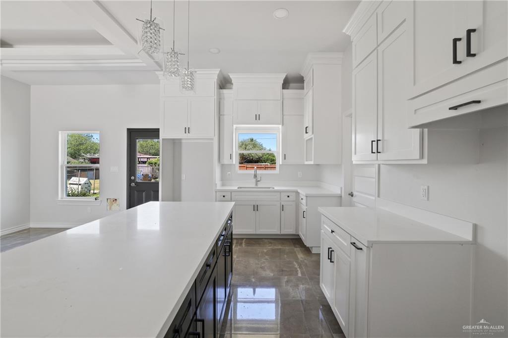 1003 Short Road San Juan, TX 78589 - Photo 17 of 20 a kitchen with a sink stove and cabinets