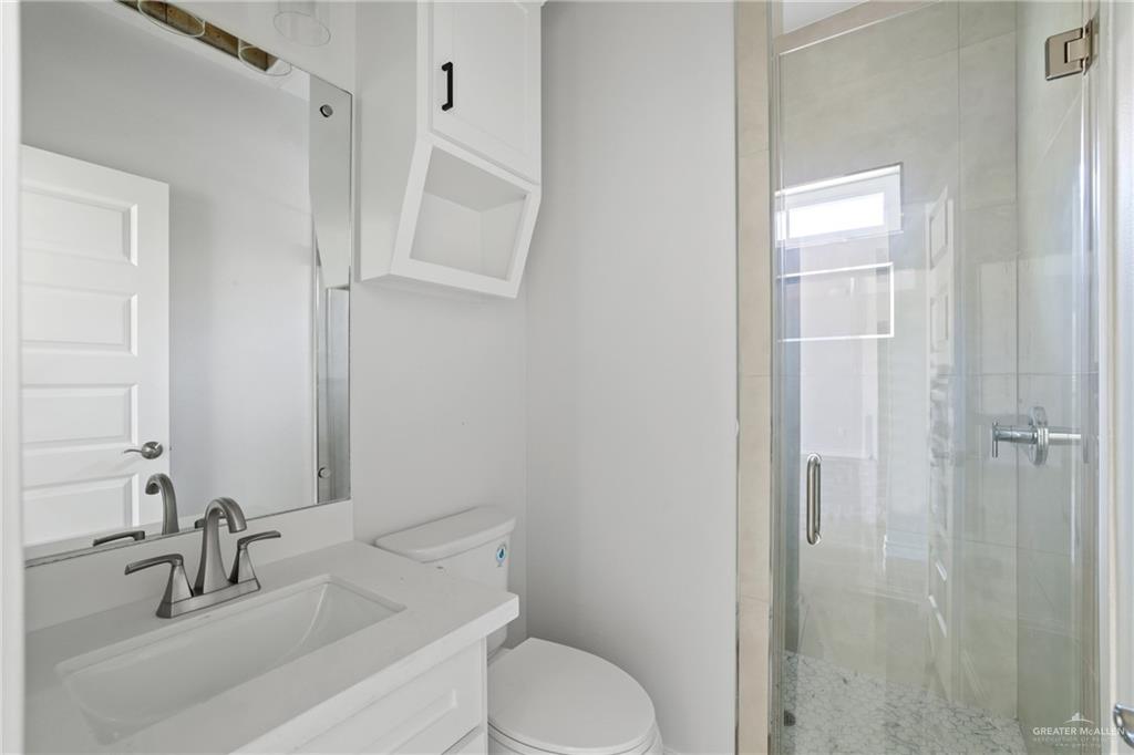 1003 Short Road San Juan, TX 78589 - Photo 3 of 20 a bathroom with a sink toilet and shower