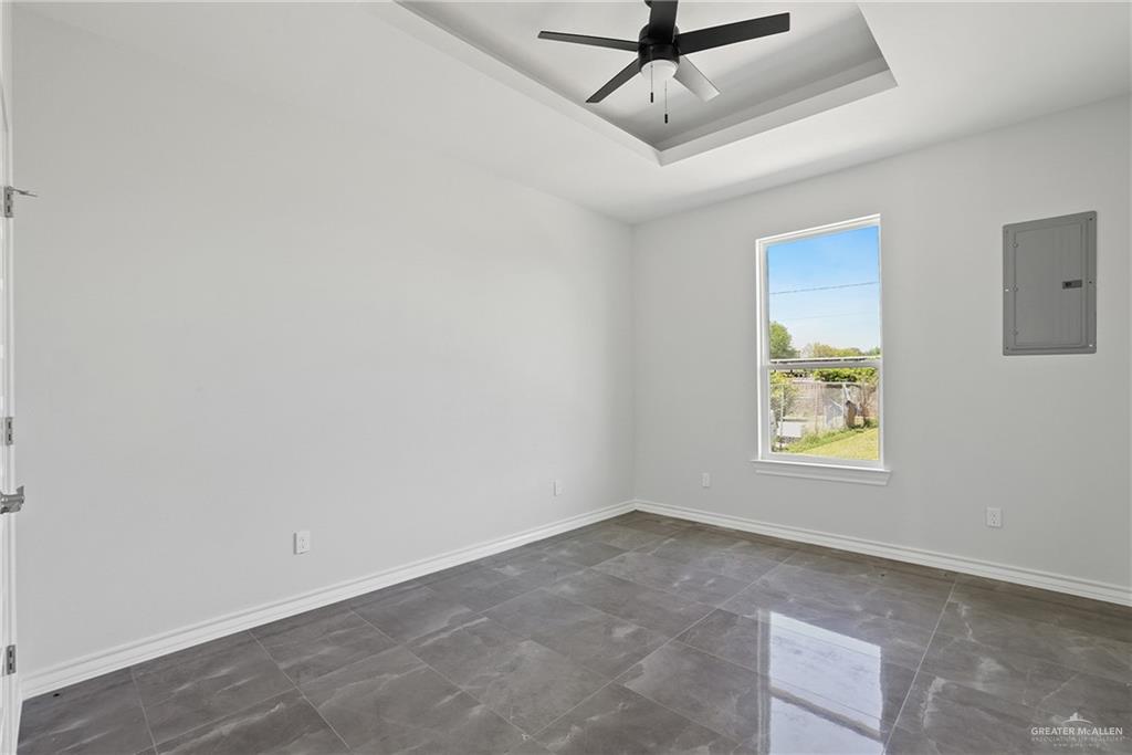 1003 Short Road San Juan, TX 78589 - Photo 6 of 20 an empty room with windows