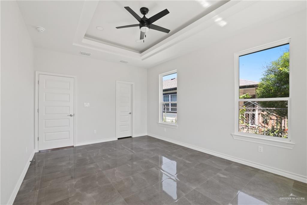 1003 Short Road San Juan, TX 78589 - Photo 8 of 20 a view of a livingroom with a ceiling fan and window
