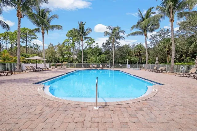 a view of a swimming pool with a patio