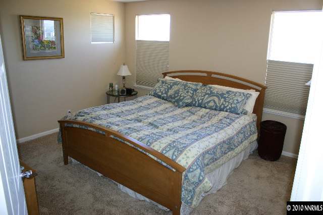 1000 South University Reno, NV 89512 - Photo 8 of 9 a bed sitting in a bedroom next to a window