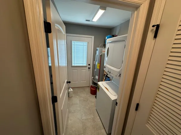 a view of a storage and utility room with a sink