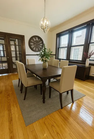 a view of a dining room with furniture and wooden floor