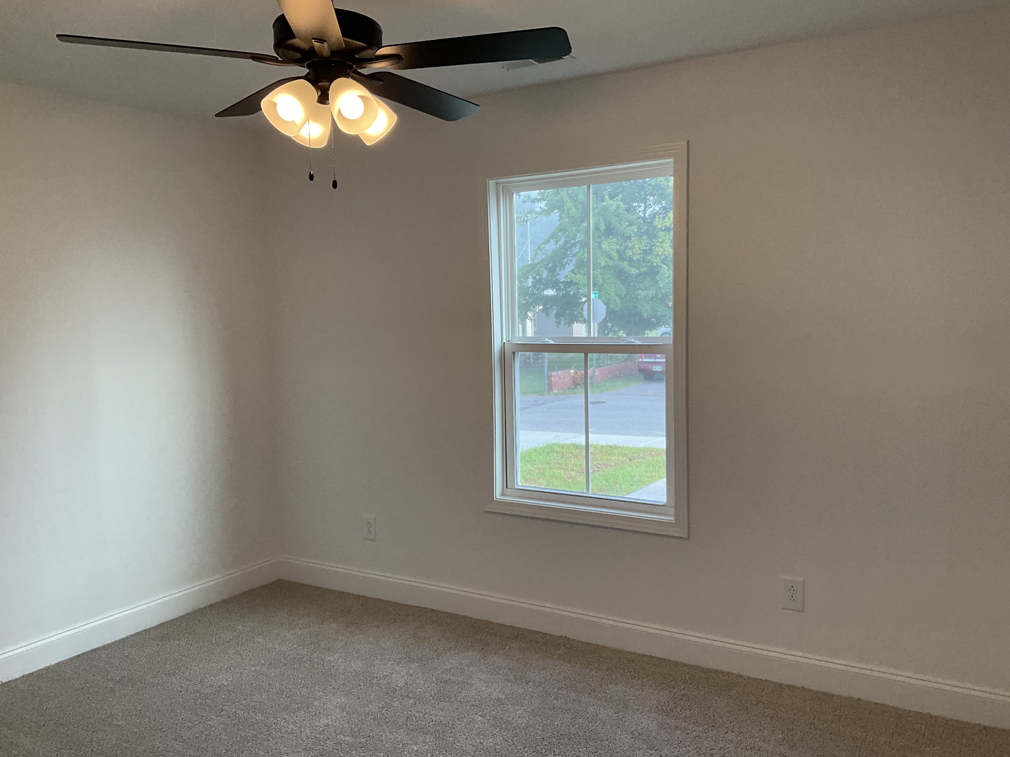 362 Baldwin Lane Springfield, TN 37172 - Photo 13 of 15 an empty room with a window and a fan