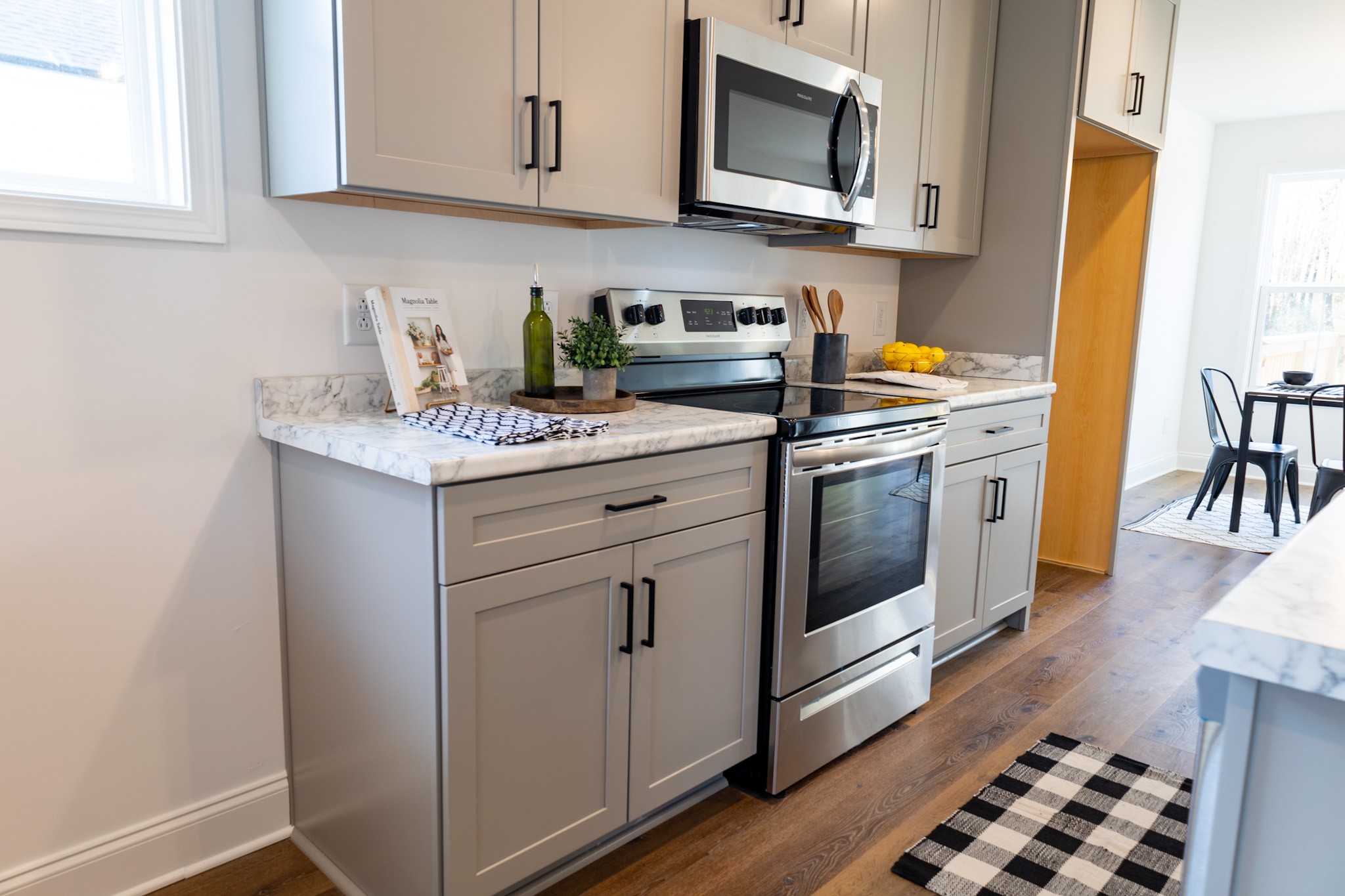 362 Baldwin Lane Springfield, TN 37172 - Photo 4 of 15 a kitchen with stainless steel appliances granite countertop a stove a sink and a microwave