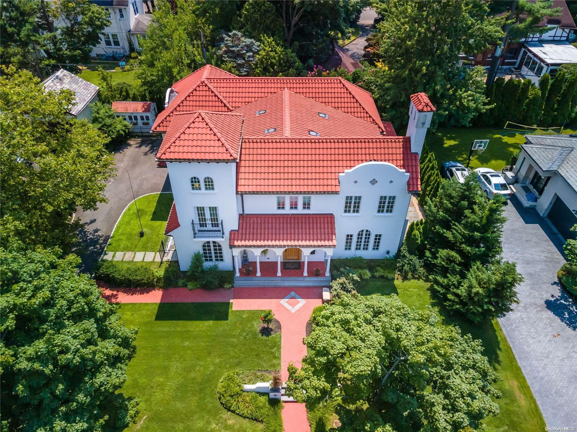 an aerial view of multiple houses with a yard