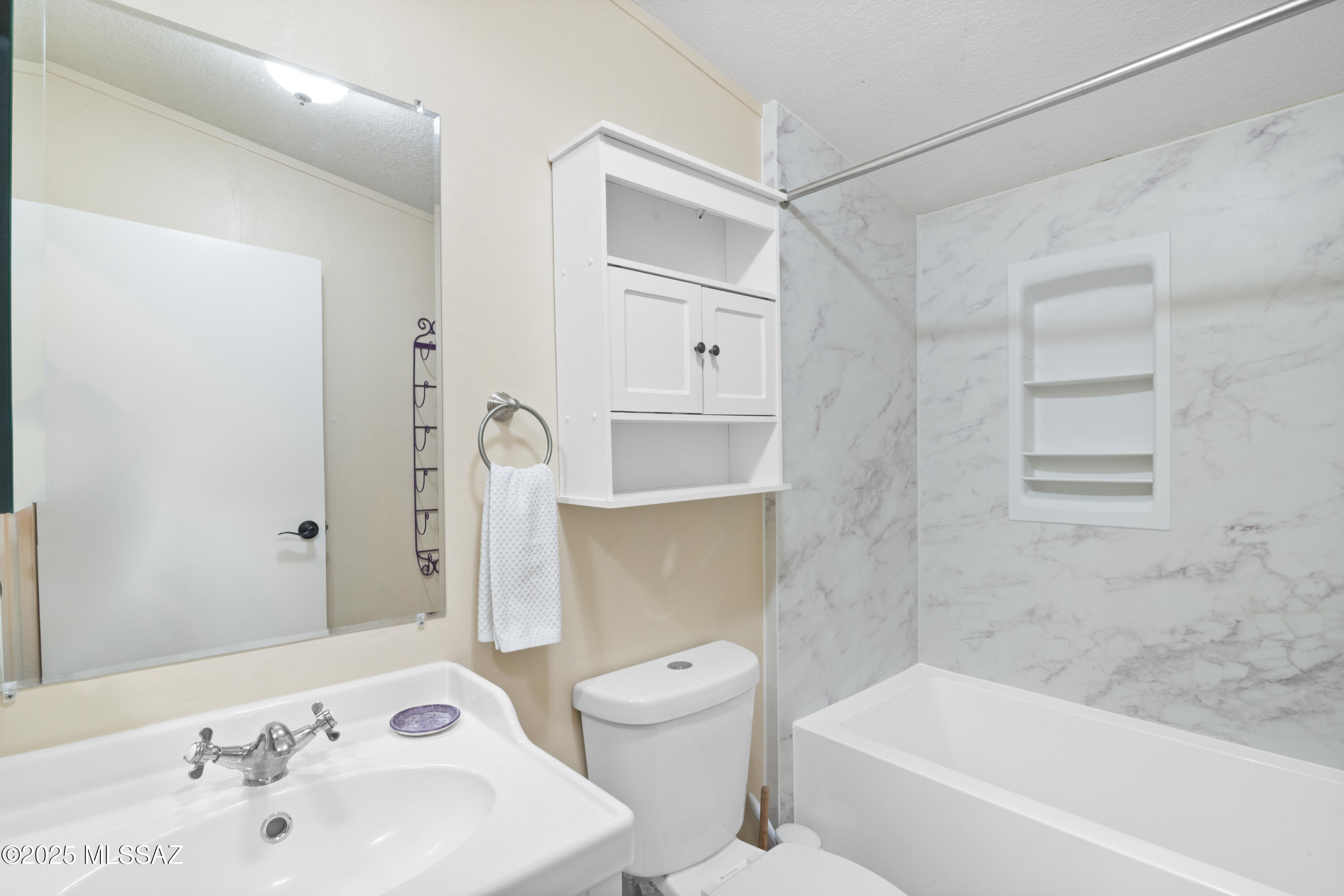 6205 East Rough Rock Drive Tucson, AZ 85756 - Photo 16 of 30 a bathroom with a sink a toilet and shower