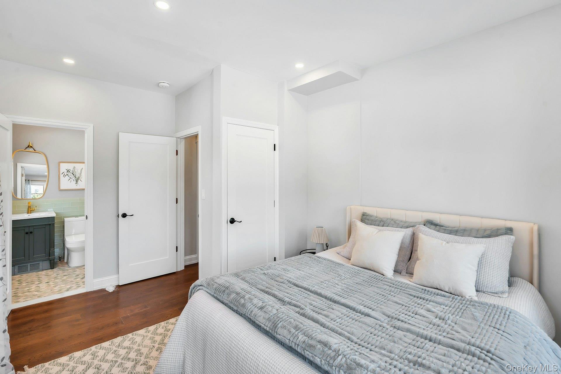 235 Cemetery Road East Marion, NY 11939 - Photo 16 of 37 First floor bedroom with closet and ensuite full bathroom with soaking tub.