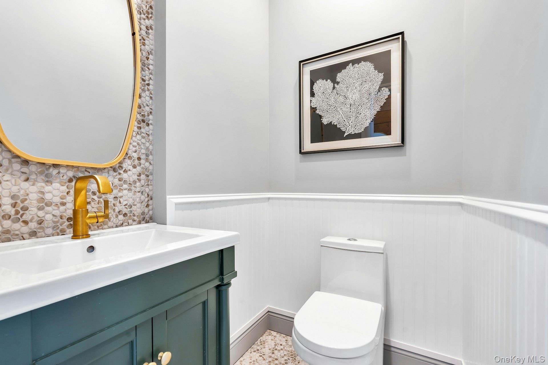 235 Cemetery Road East Marion, NY 11939 - Photo 20 of 37 Powder Bathroom located off the kitchen on the first floor.