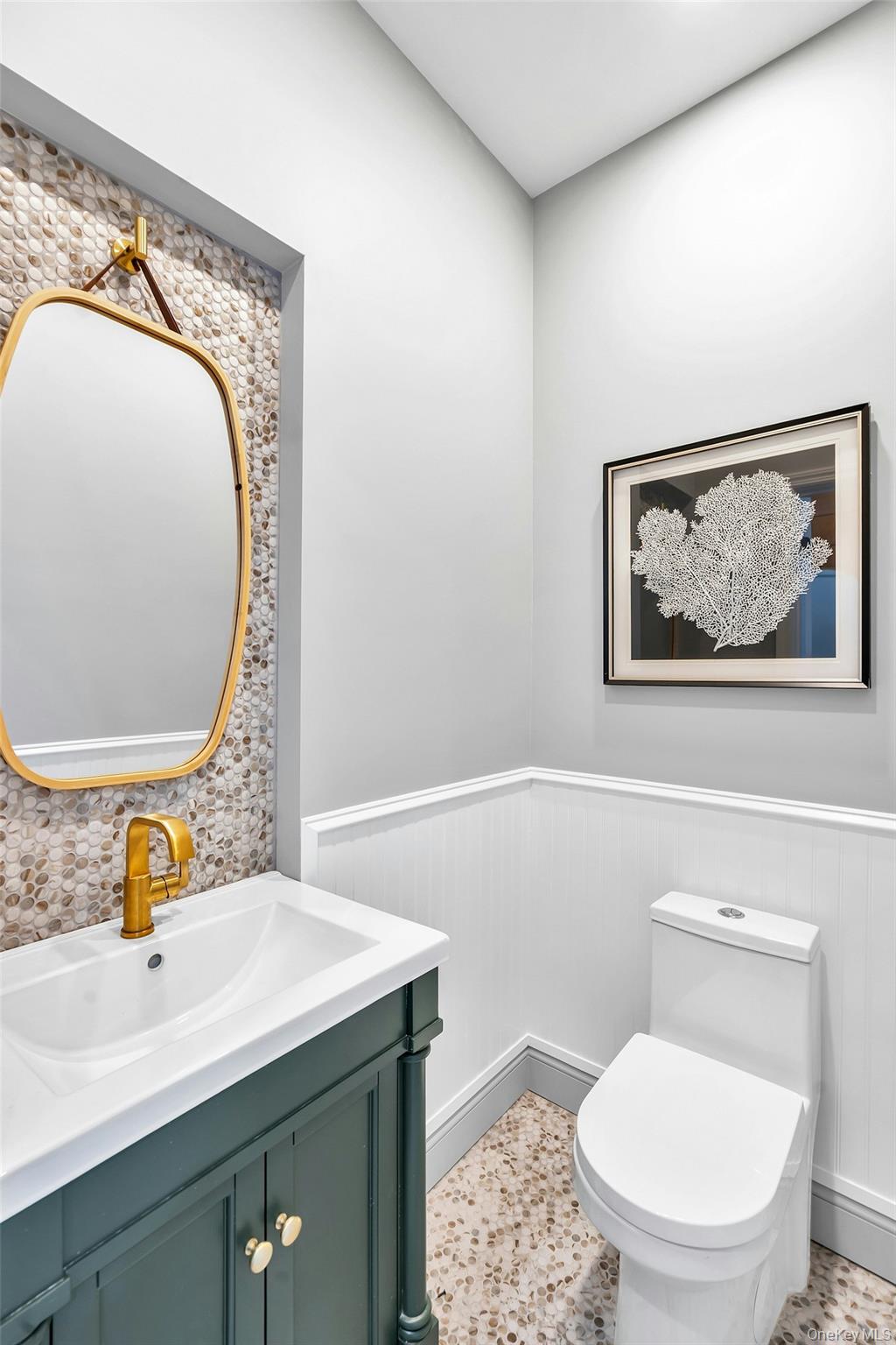 235 Cemetery Road East Marion, NY 11939 - Photo 21 of 37 Powder Bathroom located off the kitchen on the first floor.