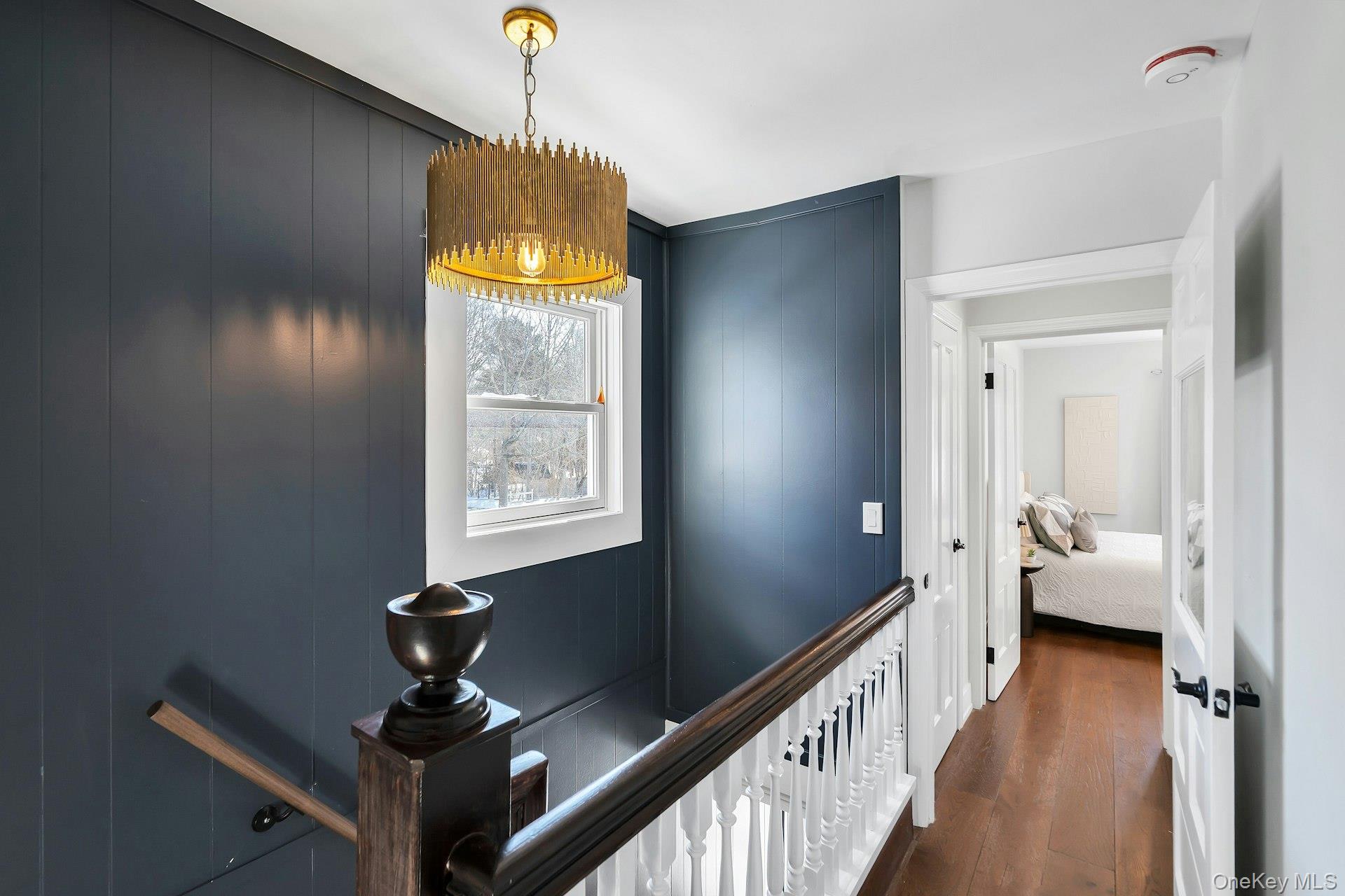 235 Cemetery Road East Marion, NY 11939 - Photo 28 of 37 Beautiful wood staircase and upstairs hallway.