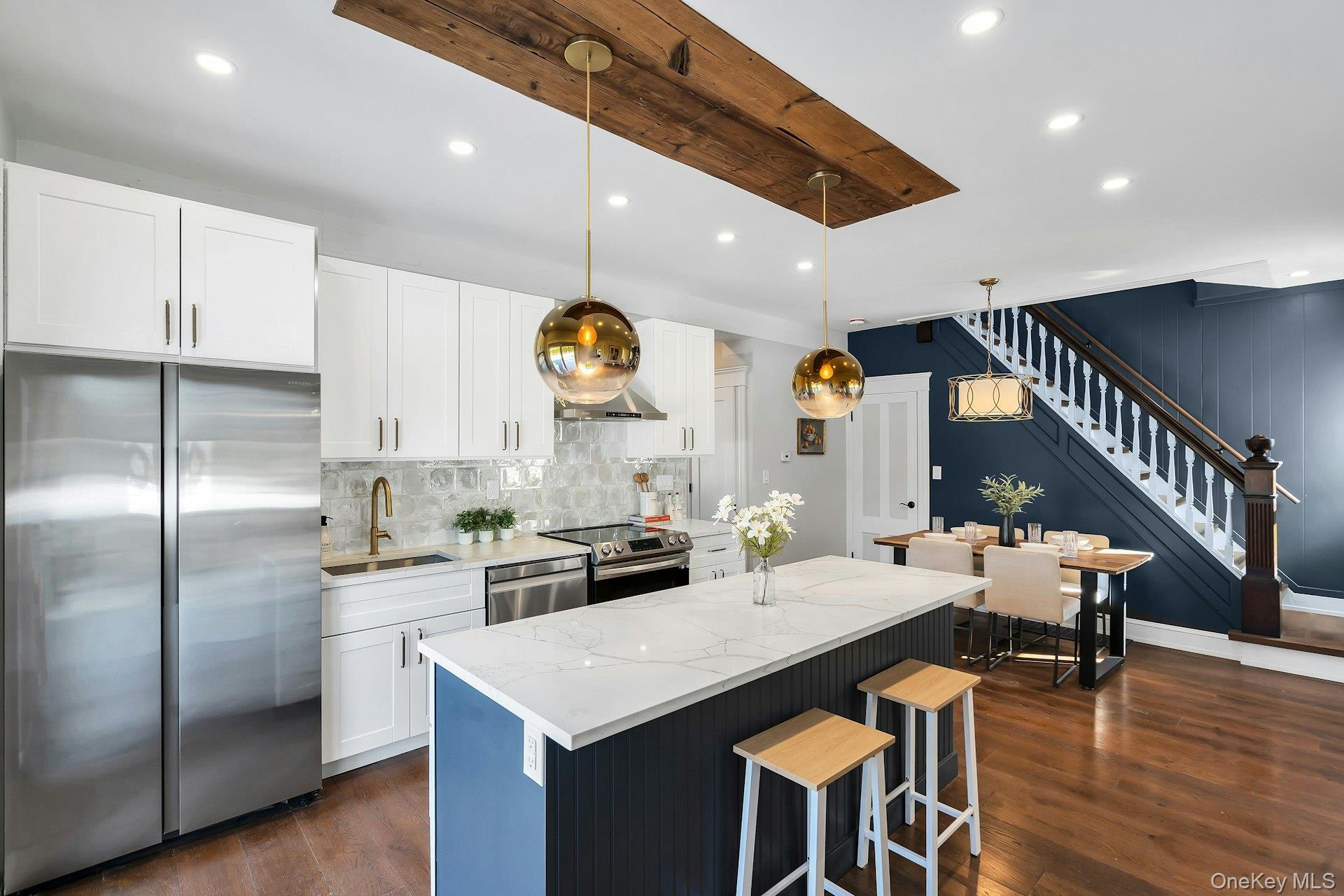 235 Cemetery Road East Marion, NY 11939 - Photo 7 of 37 New chef kitchen with high end stainless steel appliances. Large kitchen center island and wide plank floors. Charming wood staircase to second floor.