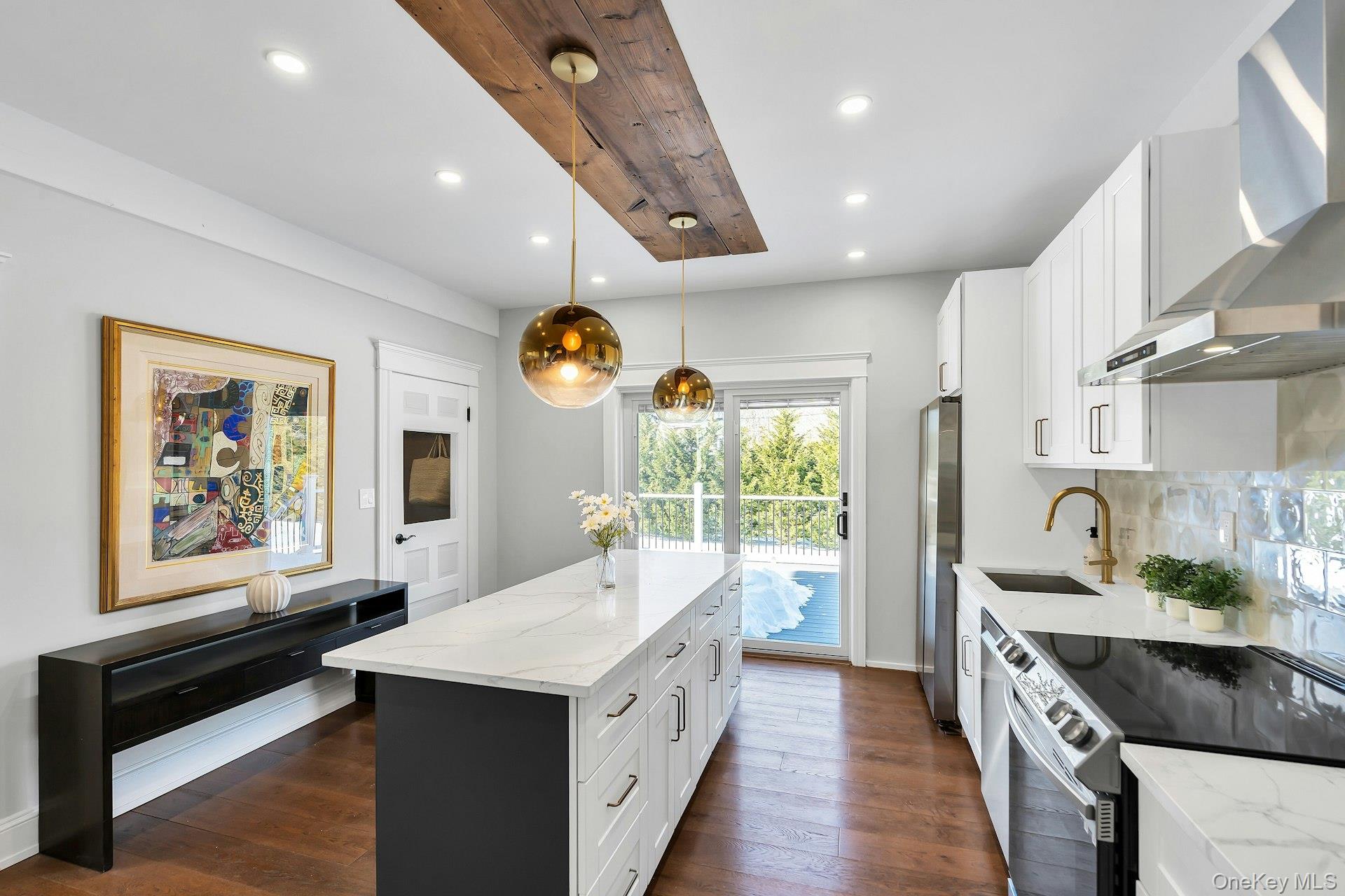 235 Cemetery Road East Marion, NY 11939 - Photo 9 of 37 Open kitchen flows through new Andersen french doors leading to a large, brand new deck.