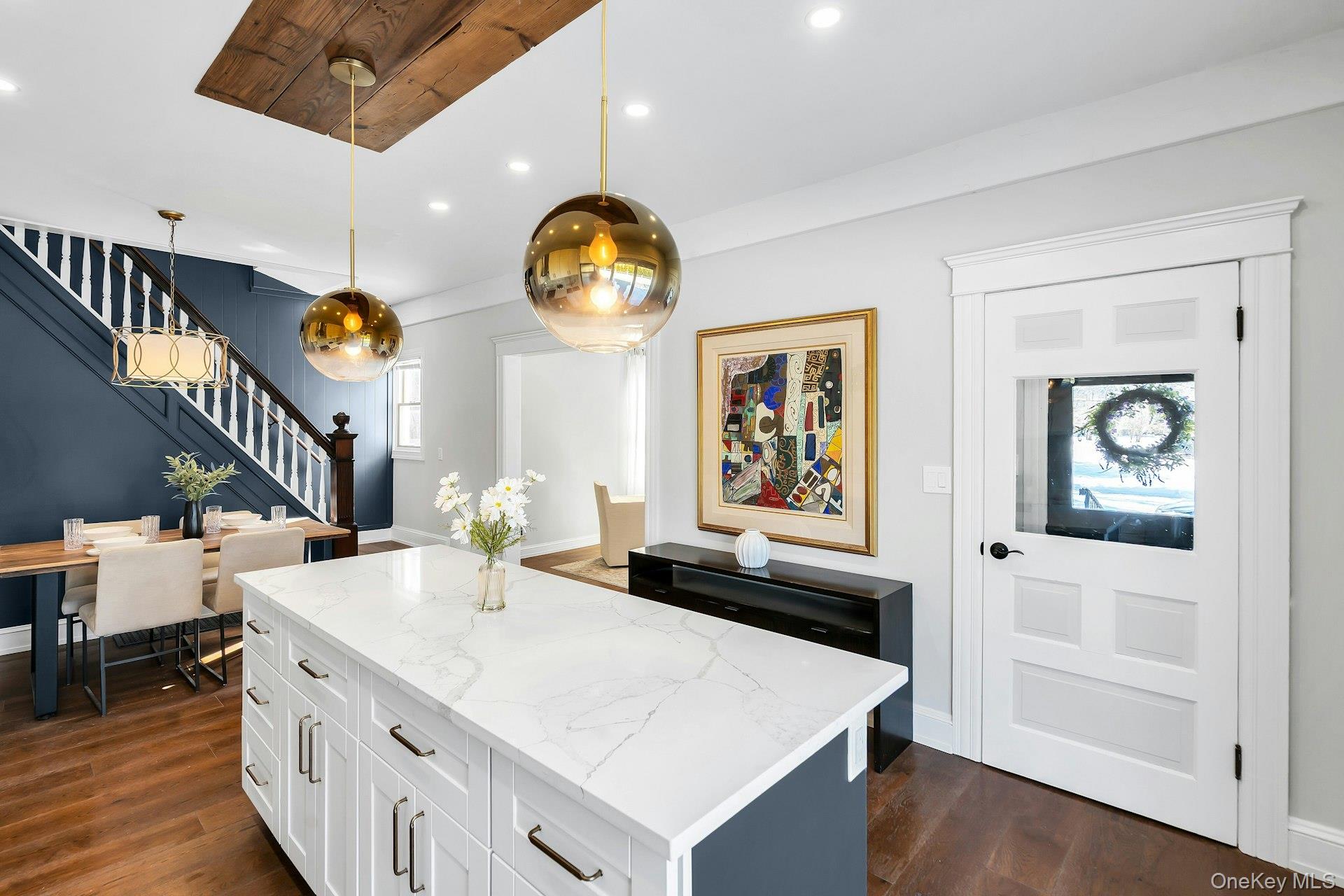 235 Cemetery Road East Marion, NY 11939 - Photo 10 of 37 White shaker cabinets with gold and brass finishes. Large kitchen center island.