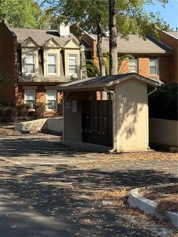 a view of a white house with a ocean view