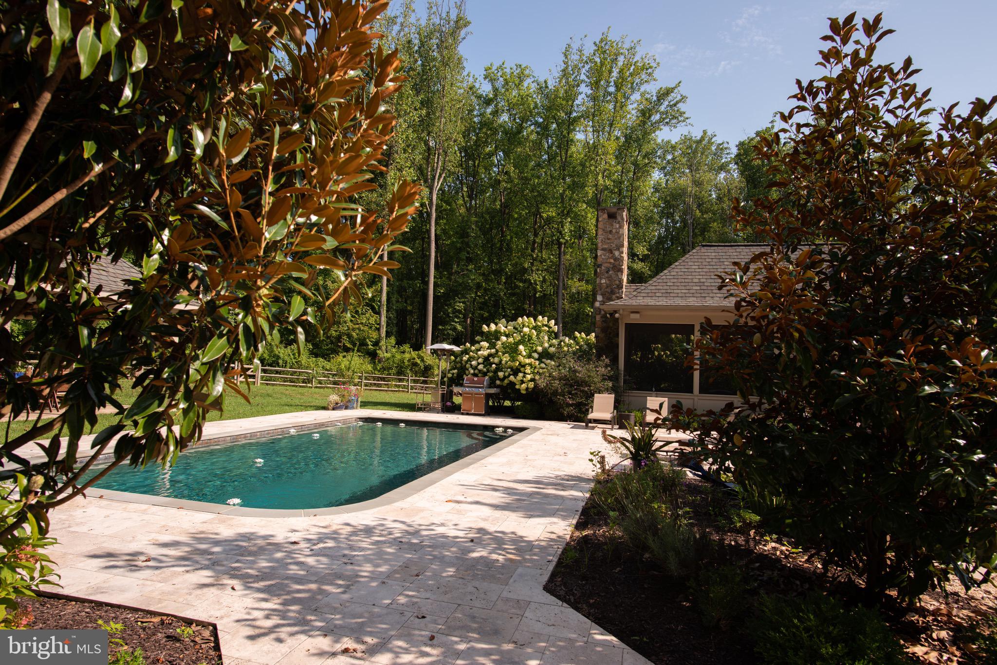 10720 Stevenson Road Stevenson, MD 21153 - Photo 54 of 64 Pool area-travertine surround