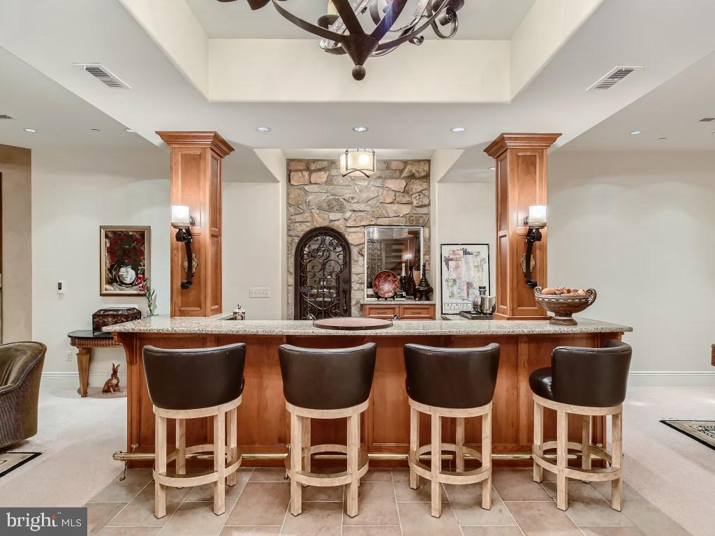 10720 Stevenson Road Stevenson, MD 21153 - Photo 56 of 64 Lower level bar w/wine cellar beyond