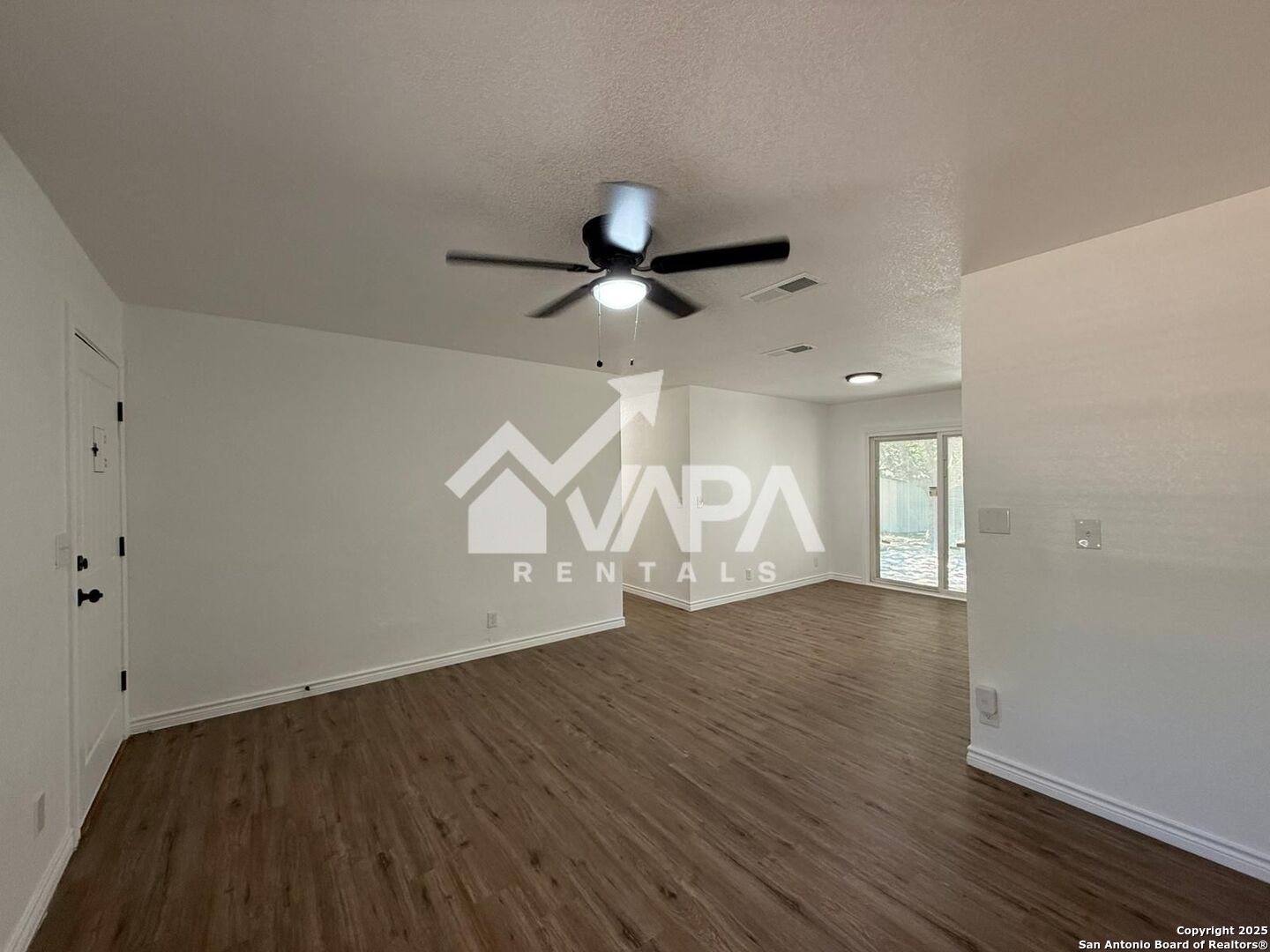 7422 Pipe Spring Street San Antonio, TX 78238 - Photo 13 of 13 an empty room with wooden floor ceiling fan and window