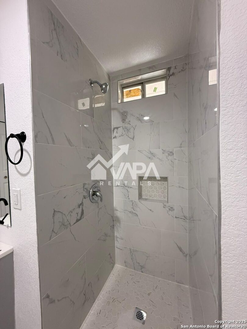 7422 Pipe Spring Street San Antonio, TX 78238 - Photo 4 of 13 a bathroom with a shower