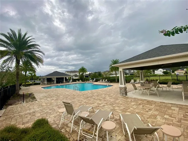 a view of a backyard with sitting area