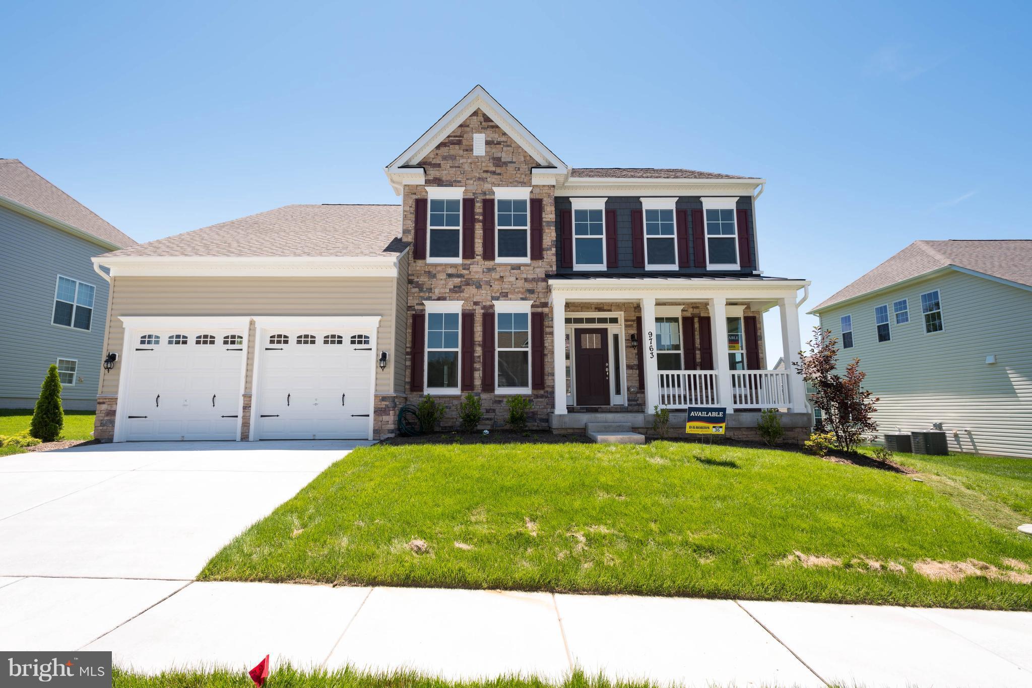 9763 Powder Hall Road Perry Hall, MD 21128 - Photo 1 of 30 a house view with a garden space
