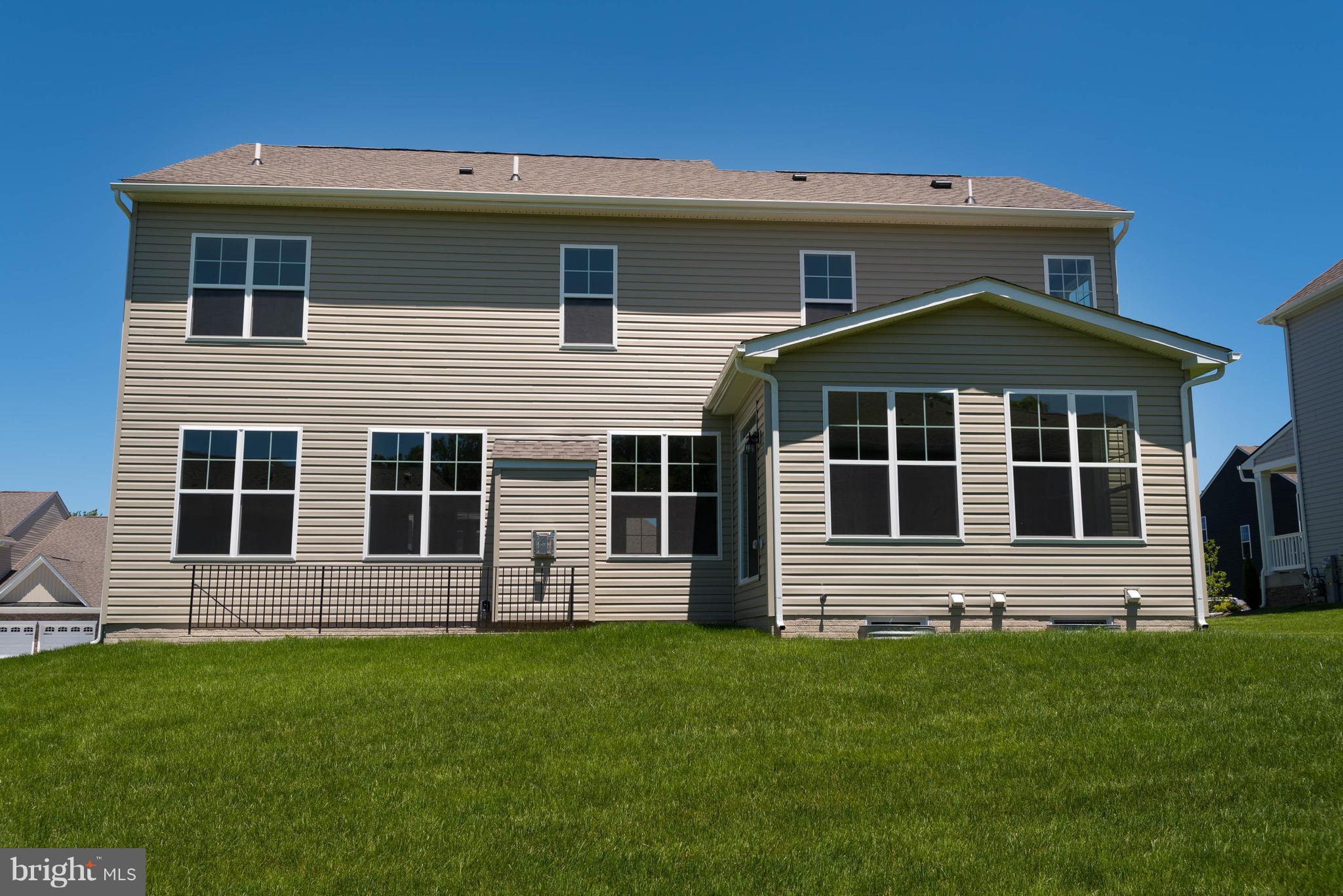 9763 Powder Hall Road Perry Hall, MD 21128 - Photo 30 of 30 a front view of a house with a yard