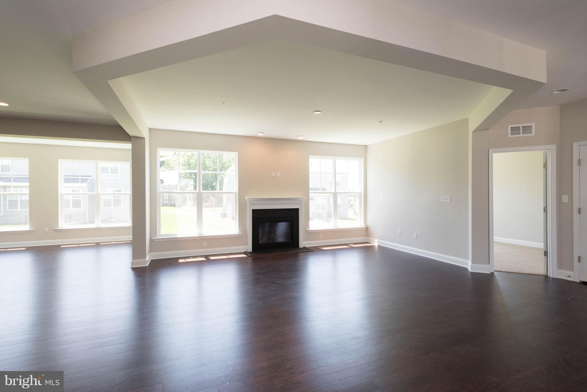 9763 Powder Hall Road Perry Hall, MD 21128 - Photo 10 of 30 an empty room with wooden floor and windows