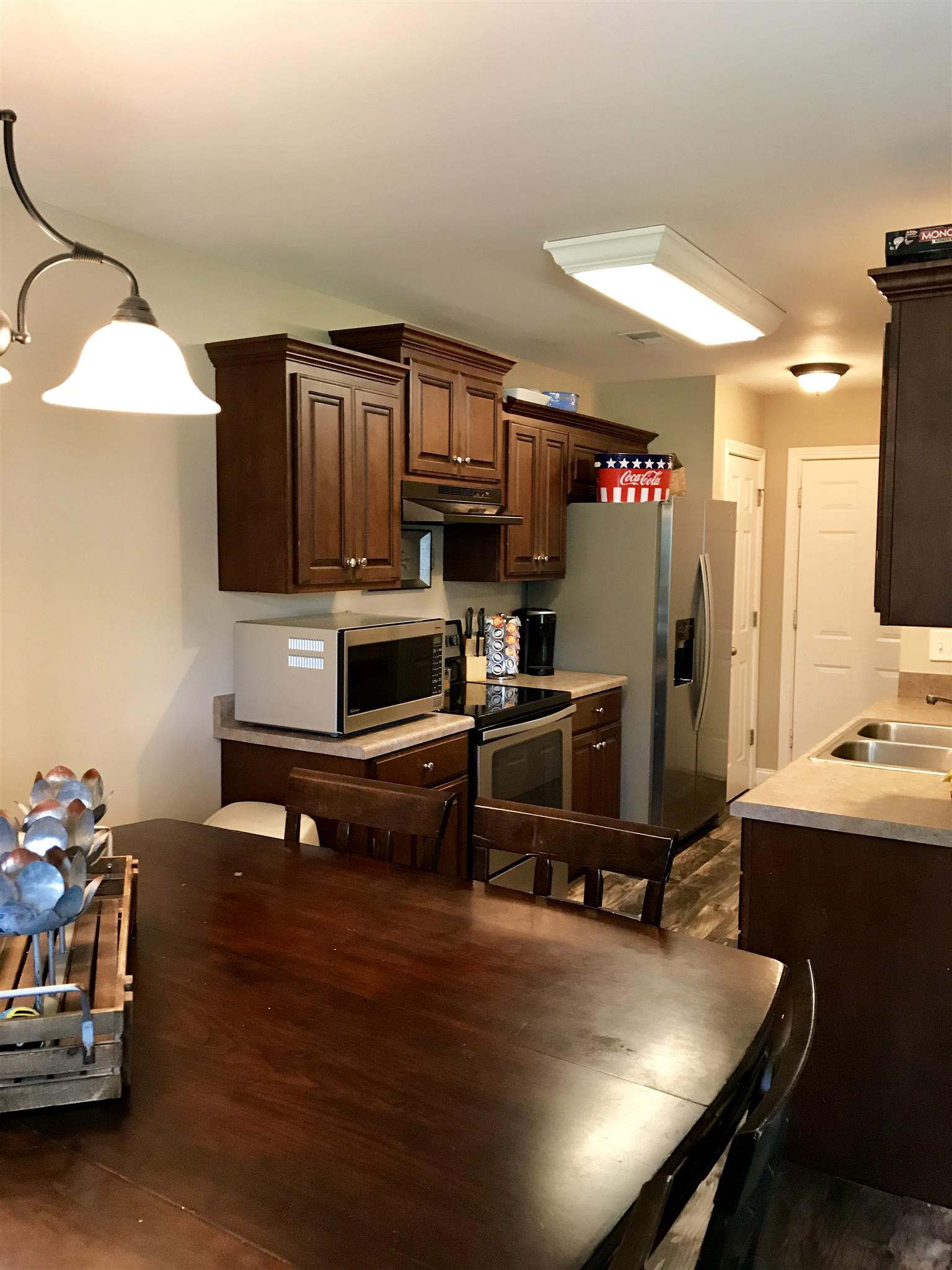 420 Nathan Street Lebanon, TN 37087 - Photo 4 of 14 a kitchen with sink refrigerator and cabinets