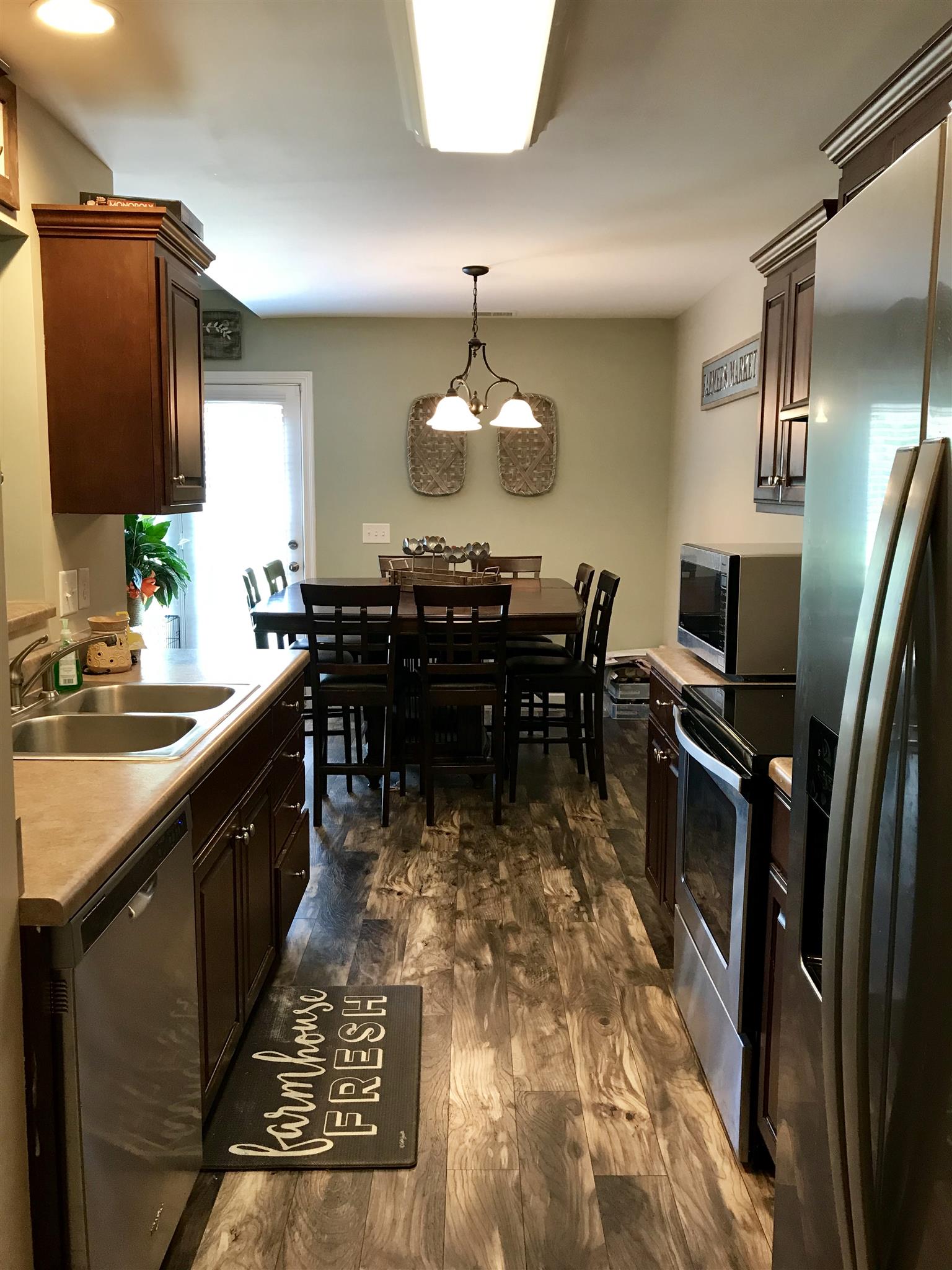420 Nathan Street Lebanon, TN 37087 - Photo 6 of 14 a large kitchen with kitchen island a sink table and chairs