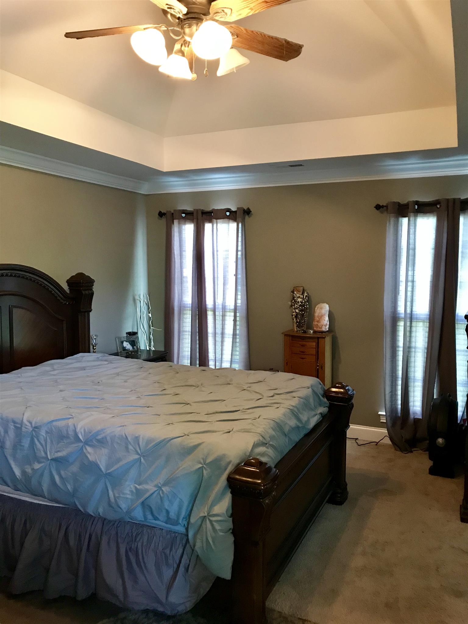 420 Nathan Street Lebanon, TN 37087 - Photo 7 of 14 a bedroom with a bed and a large mirror