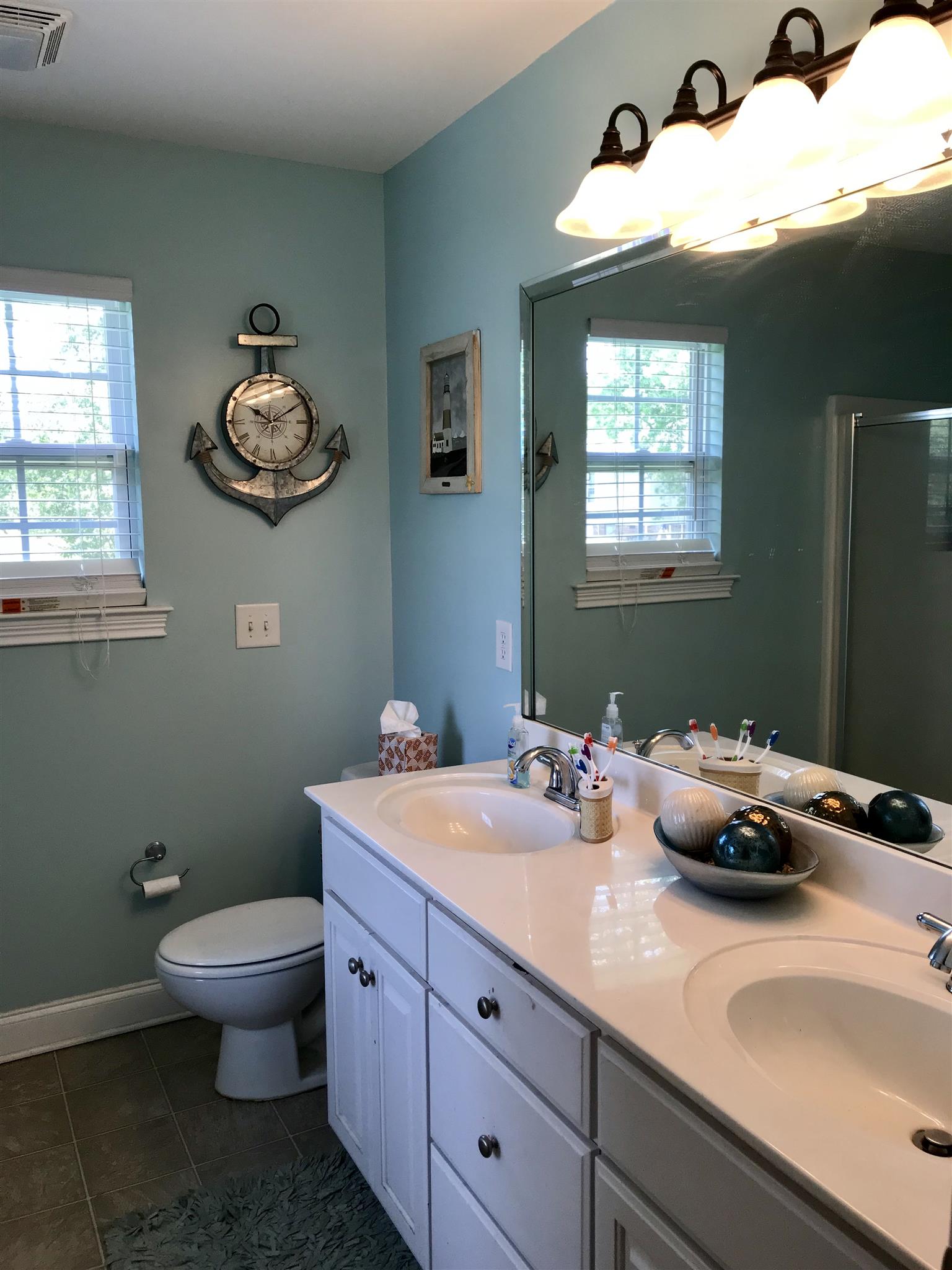 420 Nathan Street Lebanon, TN 37087 - Photo 8 of 14 a bathroom with a sink a toilet and a window